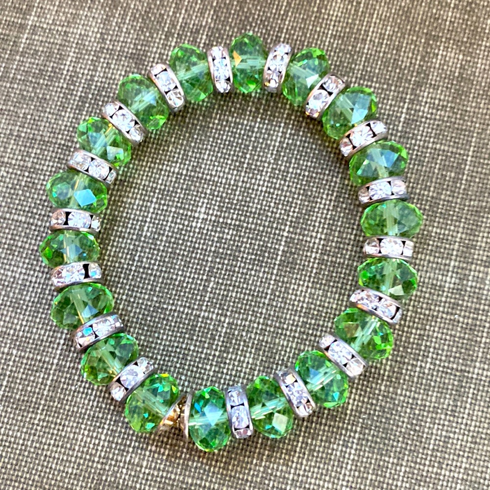 Sparkling green, faceted, crystals and white space or crystal size 6 Bracelet